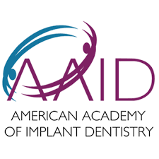 Logo of the American Academy of Implant Dentistry, representing professional affiliation of Derby Dental Care.